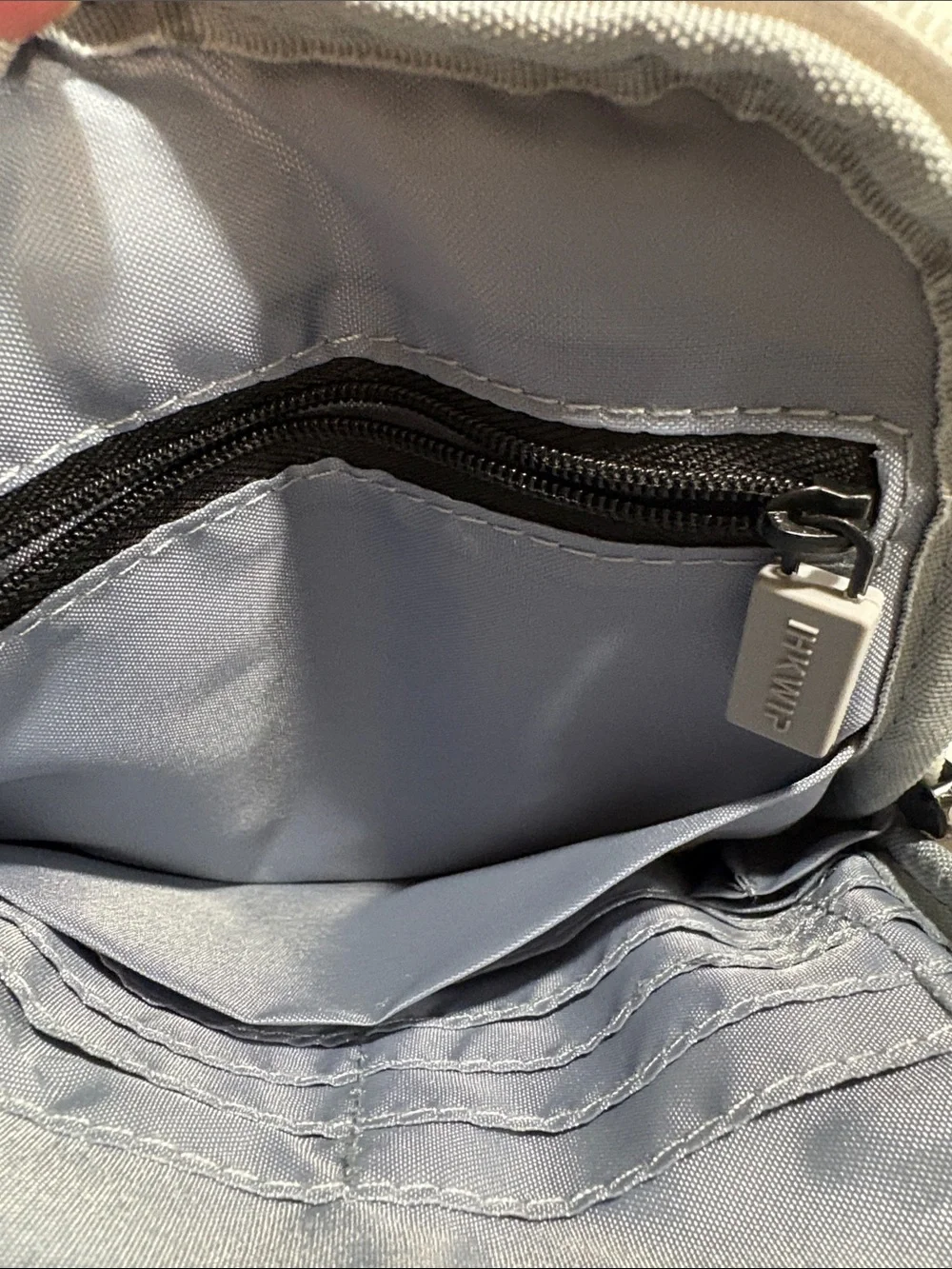 Ikwhip Metallic Matte Silver Everyday Crossbody Bag. Lots of pockets! Web strap